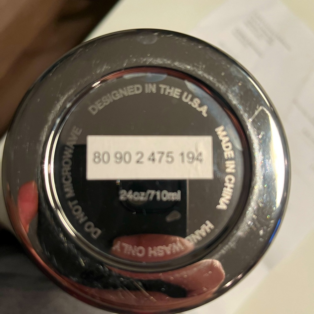 Large insulated BMW thermos.